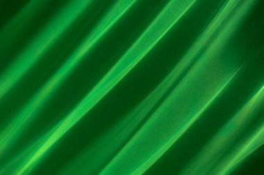 Yeşil ipek arka plan. Soyut arkaplan, ışık tarafından oluşturulan parazit kalıpları. 