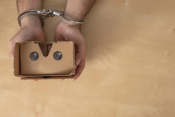 Digital Crime Concept Hands Shackles Grabbing Some Virtual Reality Glasses — Stock Photo, Image