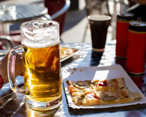 Large tankard of beer on a terrace. — Stock Photo, Image