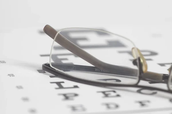Óculos Visão Teste Gráfico Fundo Close — Fotografia de Stock