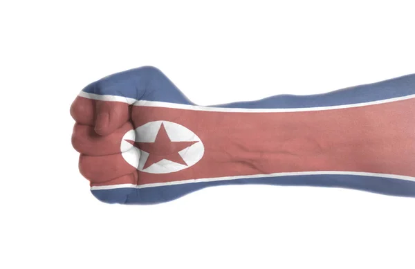 Σημαία Της Βόρειας Κορέας Από Αρσενικό Χέρι Σφιγγμένης Πυγμής Απομονωθεί — Φωτογραφία Αρχείου