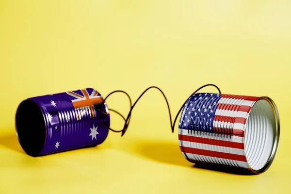 米国とオーストラリアの Flags Communication コンセプト黄色のブリキ缶電話 — ストック写真