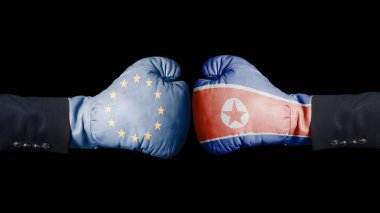Avrupa Birliği ve Kuzey Kore bayrağı ile boks eldivenleri. Kuzey Kore kavramı karşı Avrupa Birliği.
