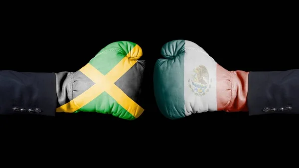 男性手在拳击手套与牙买加和墨西哥旗子 牙买加对墨西哥黑人背景的概念 — 图库照片