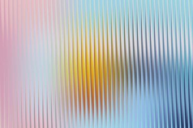 Pembe, sarı ve mavi renkli soyut desenli arkaplan tasviri