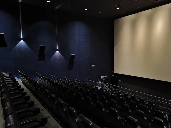 empty cinema auditorium with red seats