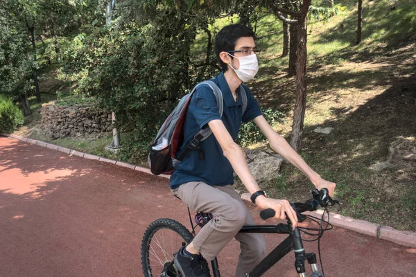 Isolated Masked Young Male Riding Bike Public Park — Stock Photo, Image