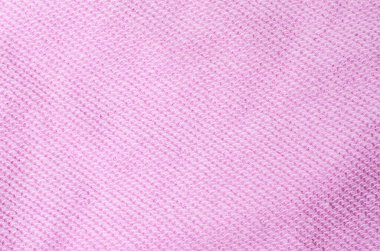 Açık pembe kumaş tekstil arka planı rahat moda tasarımı ve şık dekoratif kavramlar için döngülü dokuyu gösterir