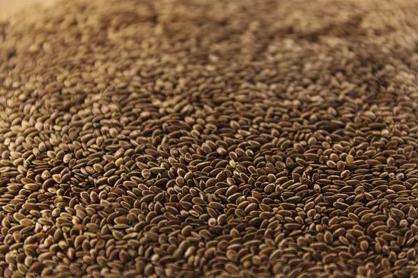 Brown flax seeds give flaxseed oil background