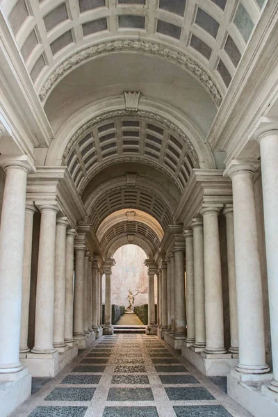 AT ROME , ITALY , ON 01/06/2018 - Forced perspective gallery by Francesco Borromini in Palazzo Spada. The corridor is much shorter, and the sculpture much smaller, than they appear.