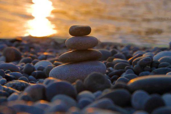 Stacked stones at sunset — Stock Photo, Image