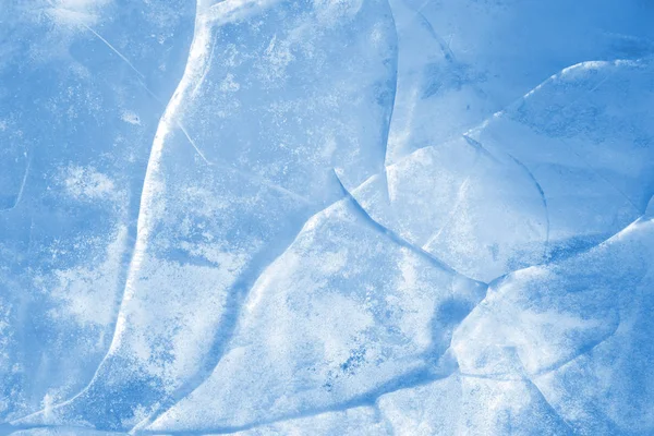 Ice background. Pattern of transparent shiny ice. Natural bright background