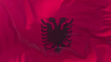 Ağır çekim klasik bayrak güneş 4 k sürekli sorunsuz döngü arka plan yükselen rüzgarlı bir günde rüzgarda pürüzsüz Arnavutluk bayrağı