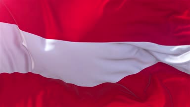 Ağır çekim klasik bayrak güneş 4 k sürekli sorunsuz döngü arka plan yükselen rüzgarlı bir günde rüzgarda pürüzsüz Avusturya bayrağı