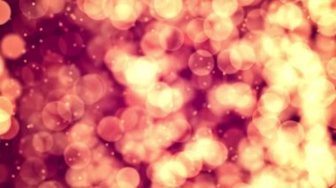 Parlayan Glittering bokeh zemin parçacıkları yanıp sönen turuncu altın soyut hareket ile toz ve titrek ışığı parçacıklar sorunsuz döngü arka plan Ödülü, olay, düğün, kutlama için titreşim