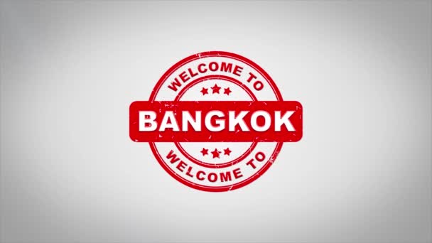 バンコクへようこそ署名スタンプ テキスト木製スタンプ アニメーションです マットの緑背景の含まれているきれいなホワイト ペーパー表面背景が付いて赤いインク — ストック動画