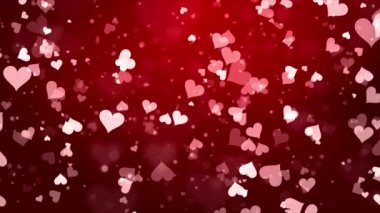 Romantik parlak kırmızı ve kalp şeklindeki parçacıklar koyu bir döngü üzerinde uçuyor..