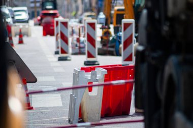 Image shows a dynamic urban construction site. The scenes highlight heavy equipment, essential materials, and safety measures, depicting a professional and well-managed site.