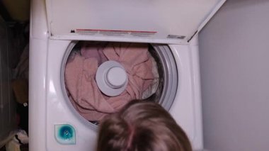 Engaging moments of laundry are showcased, featuring towels and cozy blankets in a reliable household washing machine