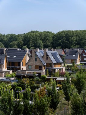 Modern residential development featuring solar panels and sustainable design principles throughout