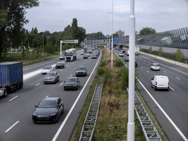 Various vehicles on multi-lane highway showing transportation infrastructure and traffic flow