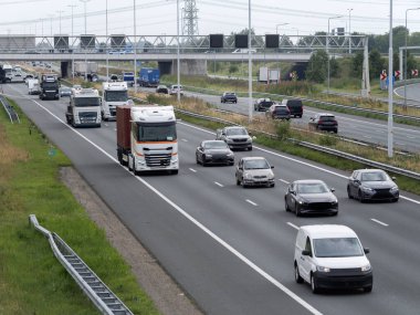 Elevated view of busy highway with trucks and cars showing transportation infrastructure