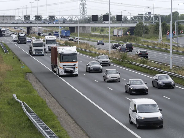 Elevated view of busy highway with trucks and cars showing transportation infrastructure