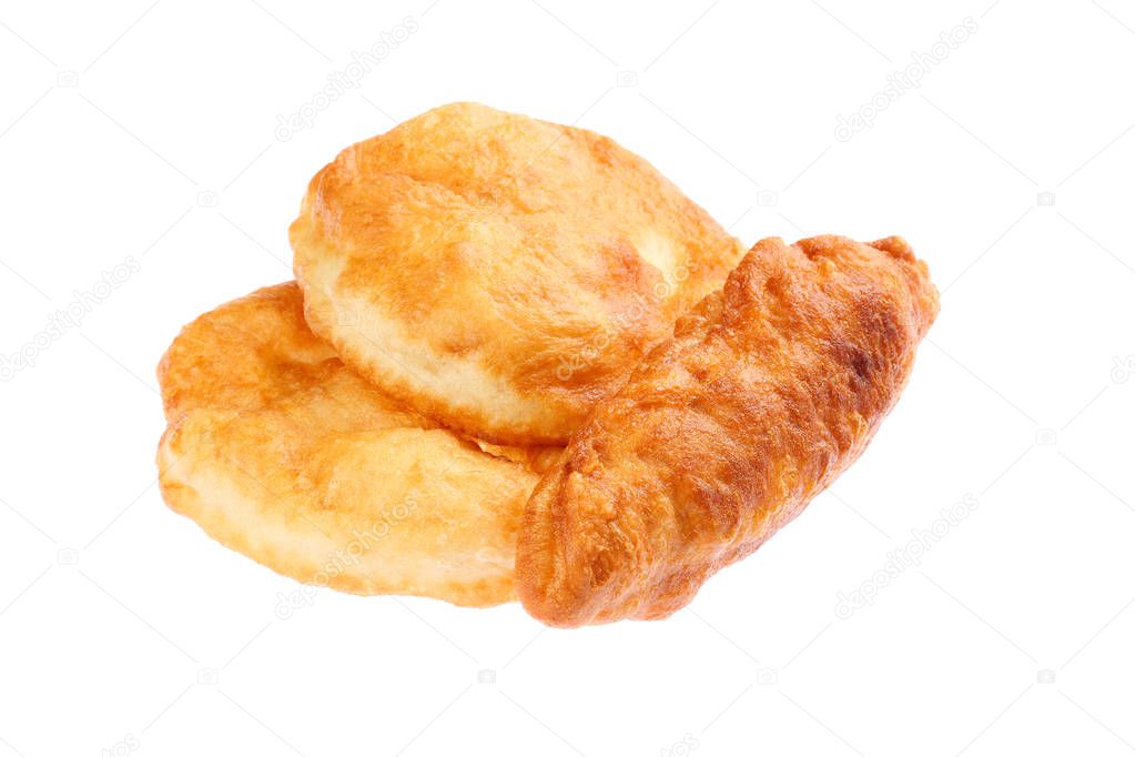 Two ordinary and one rolled, stuffed with cheese Mekitsa (Mekica), isolated on white background. Traditional Bulgarian homemade donut like breakfast, made of kneaded dough that is deep fried