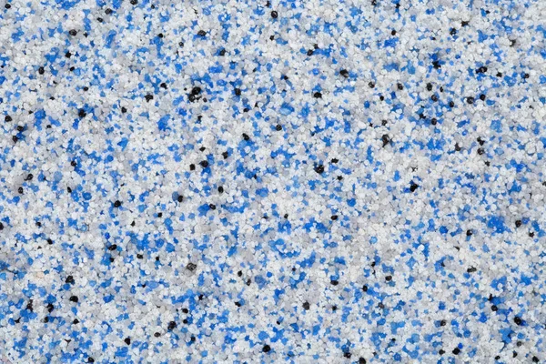 Estremamente ravvicinato di decorativi pavimenti o rivestimenti in resina epossidica di sabbia di quarzo con particelle di colore blu, grigio, bianco e nero — Foto Stock