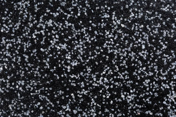 Gros plan du revêtement décoratif de sol ou de mur revêtu d'époxy de sable de quartz avec des particules de couleur grise et noire — Photo