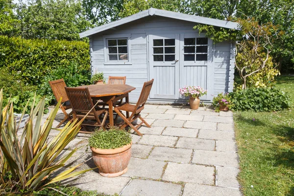 Shed with terrace and garden furniture — Stock Photo, Image
