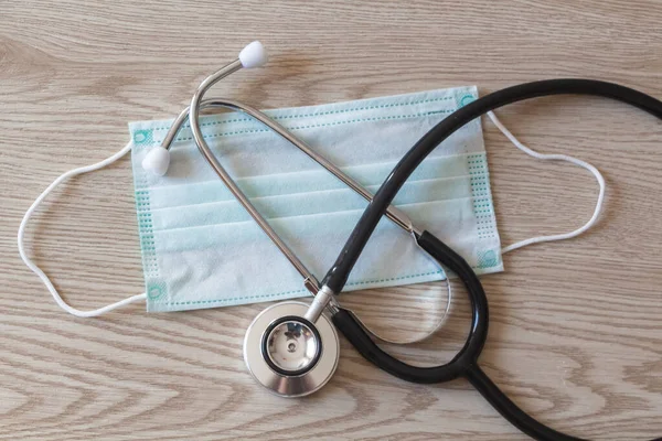 Green medical mask and stethoscope for protection against virus