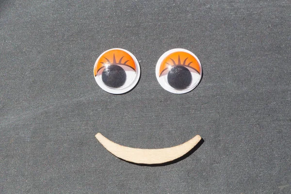 Smiling Face Made Plastic Eyes Wooden Mouth — Stock Photo, Image