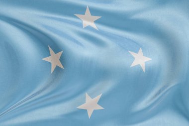 Mikronezya Birleşik Devletleri bayrağını dokulu kumaşla sallamak, özgürlüğü, kimliği ve zarif hareketi simgeliyor..