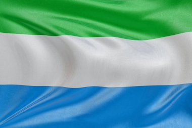 Sierra Leone 'nin bayrağını sallayan kumaşlı, nazikçe dalgalanan ve katlanan, pürüzsüz, dinamik hareket ve zarif tekstil detaylarıyla özgürlüğün ve kimliğin özünü yakalayan.