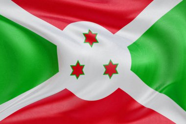 Burundi 'nin dokulu sallanan bayrağı, zarif kumaş dalgaları ve kıvrımları birliğin, özgürlüğün, bağımsızlığın ve ulusal gururun özünü yakalıyor..
