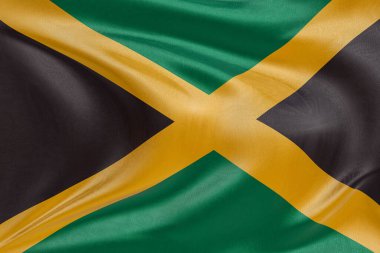 Rüzgarda dalgalanan Jamaika bayrağı, kumaş kıvrımlı ve dalgalı gerçekçi ulusal bayrak, özgürlük, birlik, miras ve vatansever kimliğin sembolü.