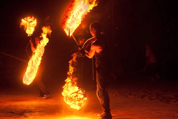 stock image BALTIYSK, RUSSIA- JULY 06, 2014: The unknown artists demonstrate the fire show at the open festival of fire in Baltiysk, Kaliningrad region.