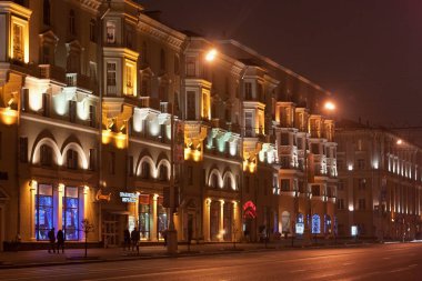 MINSK, BELARUS  - JANUARY 08, 2014: Night view of the historical buildings in the Stalin Empire style in the center of Minsk on Independence Avenue.