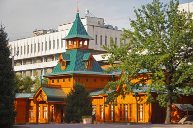 The wooden building of the Kazakh Museum of Folk Musical Instruments named after Ykylas. clipart