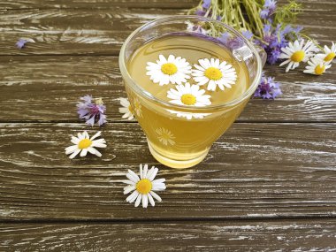 papatya çayı, ahşap bir zemin üzerine Peygamber çiçeği