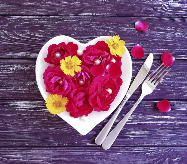 fork, knife, plate heart, flower rose on wooden background