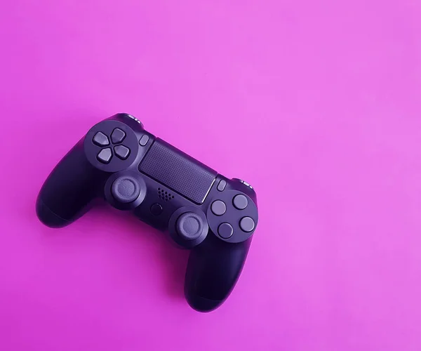 game controller black on colored paper