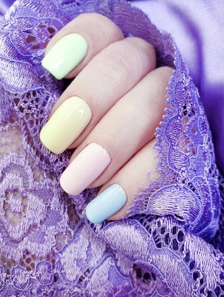 female hand, beautiful manicure, silk lace