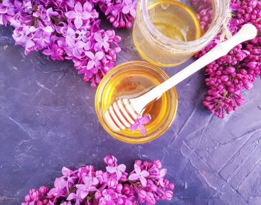 fresh honey lilac flower on black concrete background