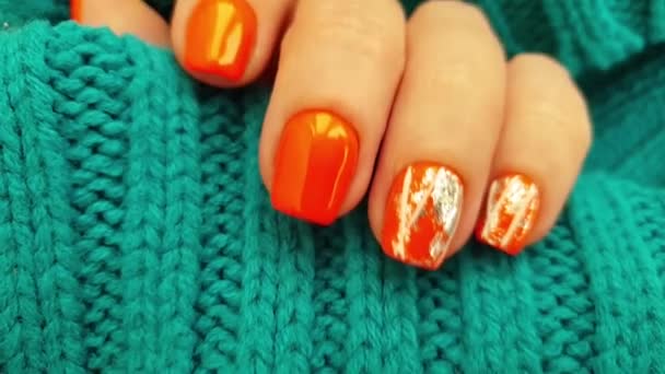 Female Hand Beautiful Orange Manicure Sweater — Stock Video