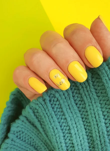 female hand nail beautiful manicure sweater