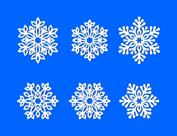 Ensemble Flocons Neige Ajourés Blancs Sur Fond Bleu Silhouette Vectorielle — Image vectorielle