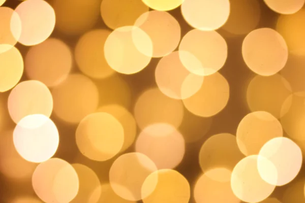ゴールド抽象的なクリスマス背景をデフォーカスしました 金色と黄色の円の背景 — ストック写真