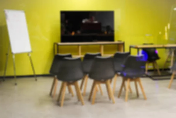blurred background. Presentation room in yellow